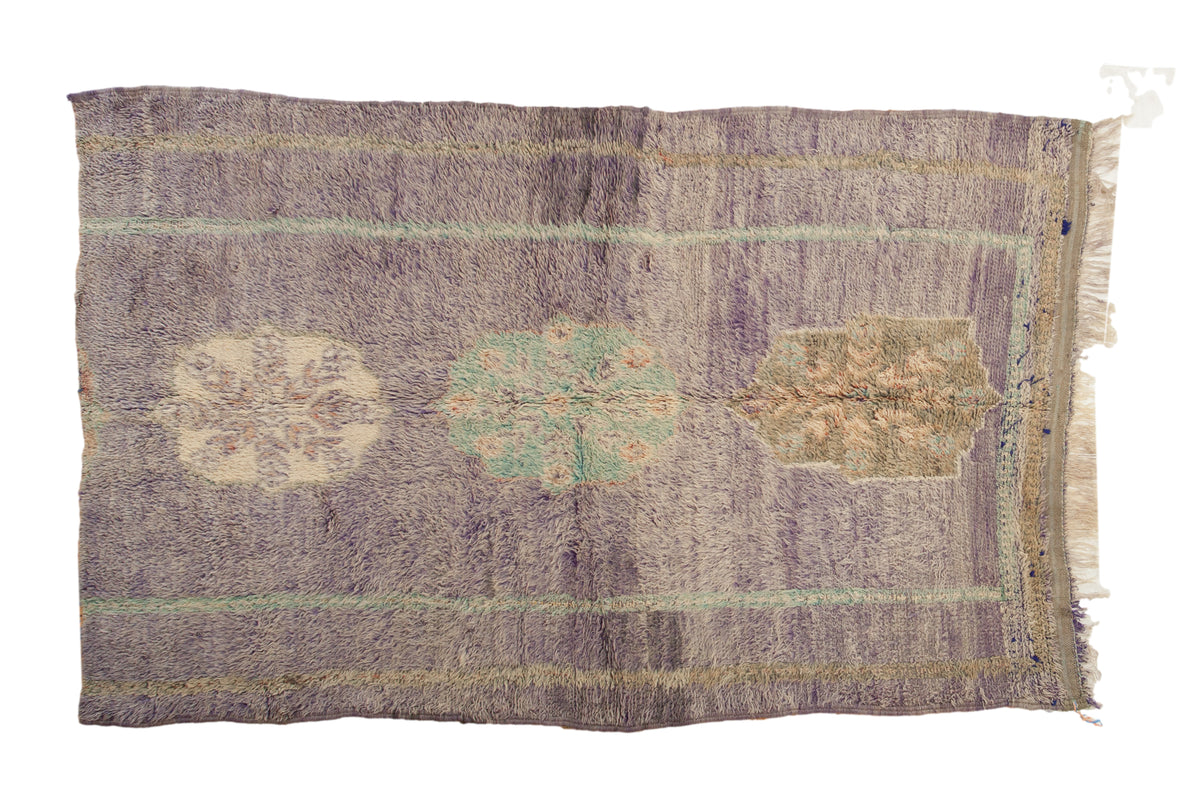 Vintage Fragment Moroccan rug with unique contoured medallions on an abrashed royal purple ground, 4'10" x 7'8".