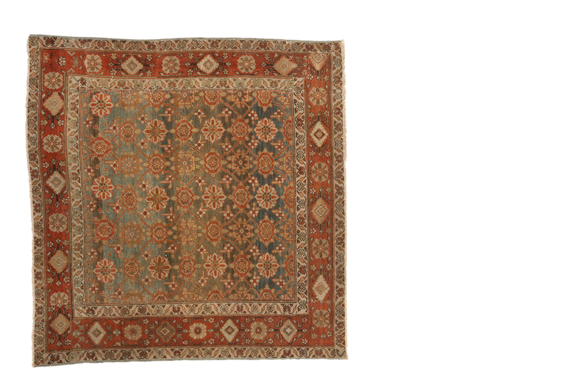 Distressed vintage Malayer square rug, dusty teal field, madder red borders, allover Mina Kahni floral.