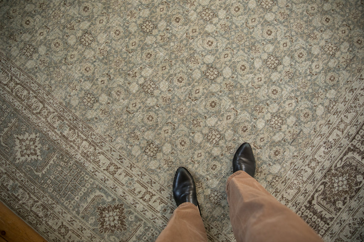 Distressed Persian Tabriz carpet with Herati motif in platinum, ivory, and oxidized silver.