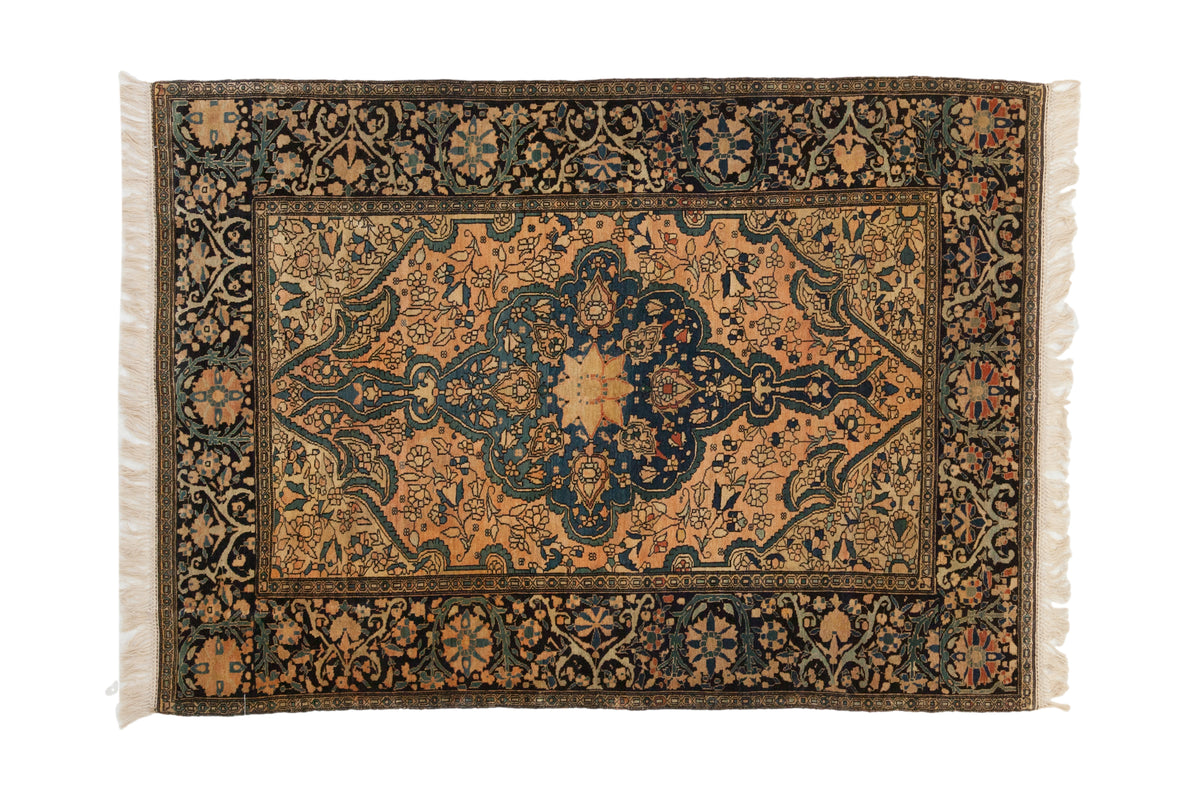 Antique Farahan Sarouk rug, roundel medallion with finials, floral vine, cantaloupe, sapphire blue, black.