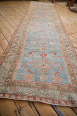 Distressed vintage Northwest Persian runner, featuring abrash blue field with Herati and pawn motifs.
