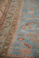 Distressed texture of a vintage Persian runner, showing powder blue Herati field and serrated leaf border.