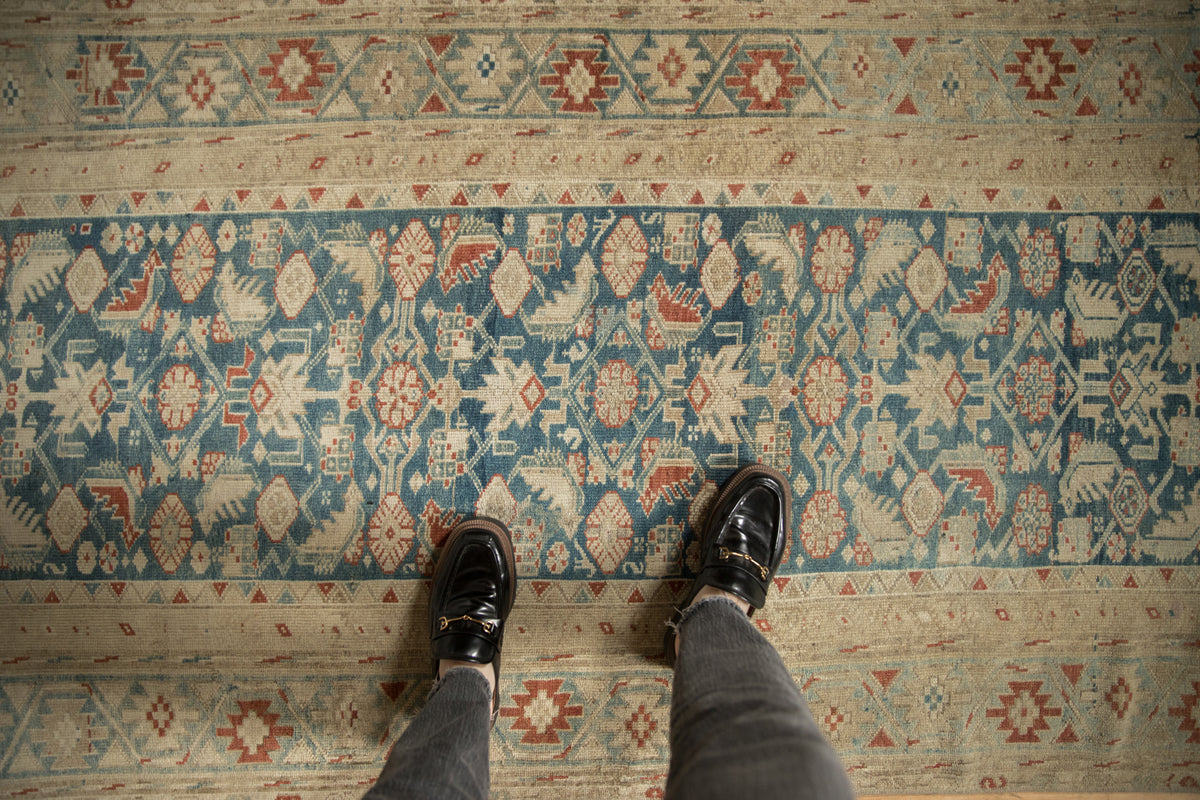Distressed vintage Malayer runner, with faded sky blue, ivory, and dusty red Herati patterns.