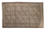 Distressed vintage Ersari carpet features repeating octagonal guls in muted earth tones.
