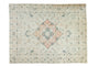 Distressed vintage Tabriz carpet, central peach medallion, muted teal, and ivory floral field. Size 9x11.8.