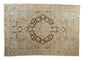 Distressed vintage Bakhtiari carpet, faded blue, sand, and brown tones with concentric medallion.