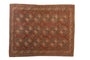 Vintage distressed Ersari carpet with repeating guls in chestnut, slate blue, and pale rose, 7'6" x 9'2".