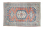 Distressed vintage Veece carpet, faded melon red and dusty sapphire blue geometric medallion, 6'11" x 10'5".