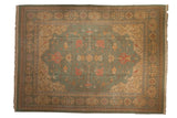 Indian Soumac carpet with a Serapi design in tea-washed seafoam green, pale gold, and terracotta.