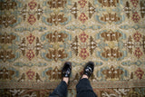 Embossed William Morris style Arts and Crafts carpet with floral palmettes in beige, blue, and red.