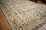 Embossed floral palmette field and sprawling William Morris style border detail.