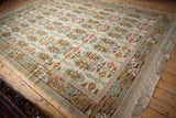 Embossed pile texture, intact fringe, and sprawling William Morris style border detail.