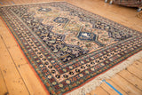 Vintage Ardebil carpet border and pale peach field with traditional animal motifs.