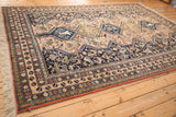 Vintage Ardebil carpet, pale peach field with navy blue animal and people medallions.