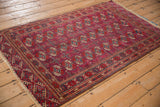 The intact side cord selvage and intricate geometric borders of a vintage Turkmen Tekke rug.