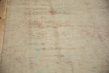 The distressed texture of the short ivory pile with soft raspberry and blue hues.