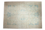 Vintage distressed Polonaise design carpet with a faded medallion in soft powder blue and ivory.