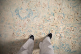 Detail showing the distressed low pile and even wear to the knot heads on the vintage carpet.