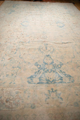 Low perspective view of the distressed vintage rug, highlighting its soft texture and even wear.