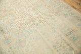 Distressed Bulgarian Bijar rug's faded Herati pattern in pale blue, rose, and beige.