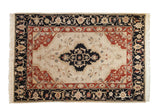 Vintage Armenian Serapi carpet, dark navy quatrefoil medallion on ivory field, madder red florals.