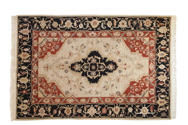 Vintage Armenian Serapi carpet, dark navy quatrefoil medallion on ivory field, madder red florals.
