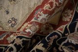 Rich madder red and navy floral palmettes on a thick vintage Serapi design pile.