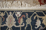 Armenian Serapi rug with original ivory fringe and deep navy blue floral vine detail.