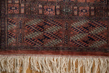 Intact ivory fringe and plush terracotta wool pile on a fine vintage Bokhara rug runner.