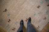 Hand woven Indian Folk Art rug: beige texture with teal and chocolate art silk animals.