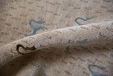 Plush beige pile texture and art silk animal motifs on the Indian Folk Art rug.