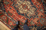 Overhead view of the Heriz design carpet's medallion in rust, ivory, and sapphire blue.