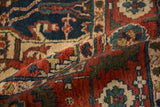 Richly textured full pile of a vintage Indian Heriz rug in rust, blue, and ivory.