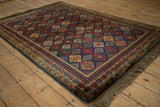 Angled view of a vintage Indian Jaff Kurd rug, highlighting its rich sheen and geometric design.