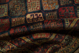 Soft folds of a vintage Indian rug showing its dense, lustrous pile and rich geometric pattern.