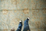 Powder blue Oushak design with expressive beige serrated palmettes and delicate vinery.