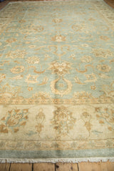 Lustrous powder blue Indian Oushak pile with beige serrated palmettes and delicate vinery.