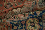 Lush, full pile of a vintage Bulgarian rug with contrasting navy blue border and dusty blush field.