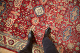 Close-up of the vintage Indian Heriz carpet's plush wool pile and repeating geometric gul motif.