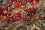 Close view of the full, lustrous wool pile and floral motifs on a vintage Heriz design carpet.