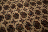Plush, high-sheen wool pile showing the detailed gul medallions of a fine Bokhara carpet.