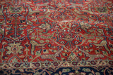 Close-up of the shadow-outlined Samovar design and plush red pile on a vintage Agra carpet.