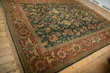 Angled view of a vintage Serapi design carpet, showing its lustrous pile and detailed floral pattern.