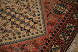 Close-up view of the full pile and geometric tribal patterns on a vintage Persian Abadeh rug.