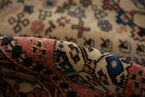 Close-up view of the original full pile and hand-knotted texture of the vintage Abadeh rug.