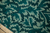 Shallow carved contour highlighting the serrated leaf pattern in teal and pale jade green.