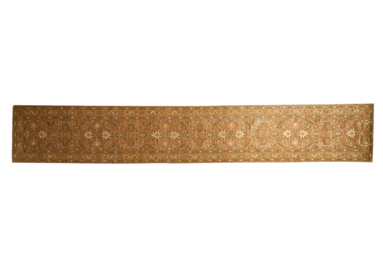 Hand-knotted Peshawar rug runner with floral cross-sections and palmettes in shades of sandalwood and ivory.