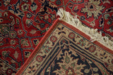 Vintage Agra carpet corner detail: ivory thousand flower border, brick red field, and fringe.