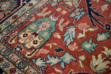 Close view of a gul ferang motif with rose florals in jade green on a red field.