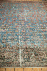 Vintage Mahal carpet detail: aqua blue field with worn repeating floral motifs.